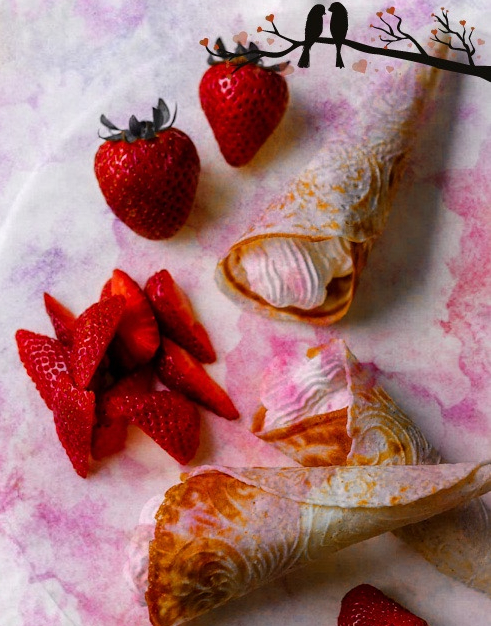 nowegian krumkake cookies on a plate with strawberries, additional photoshop editing with a border of 2 birds on a tree with hearts for leaves ala norwegian wood. Pic lifted from https://true-north-kitchen.com/krumkake/
