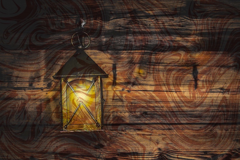 lantern against a swirled wood background