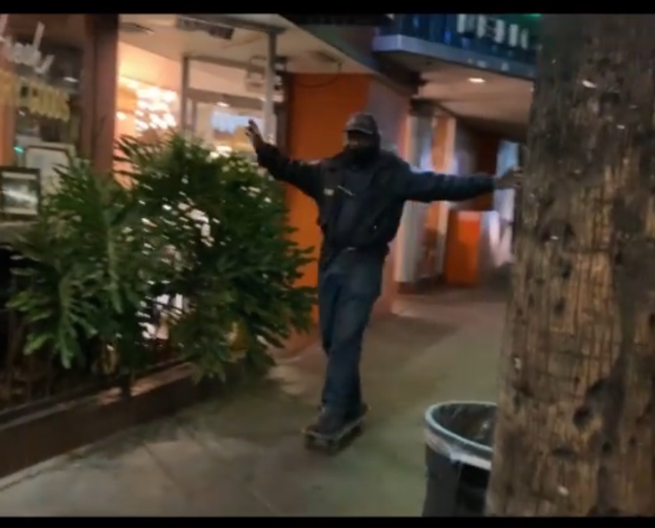 Robert, a local LA security guard, rides a skateboard he found.